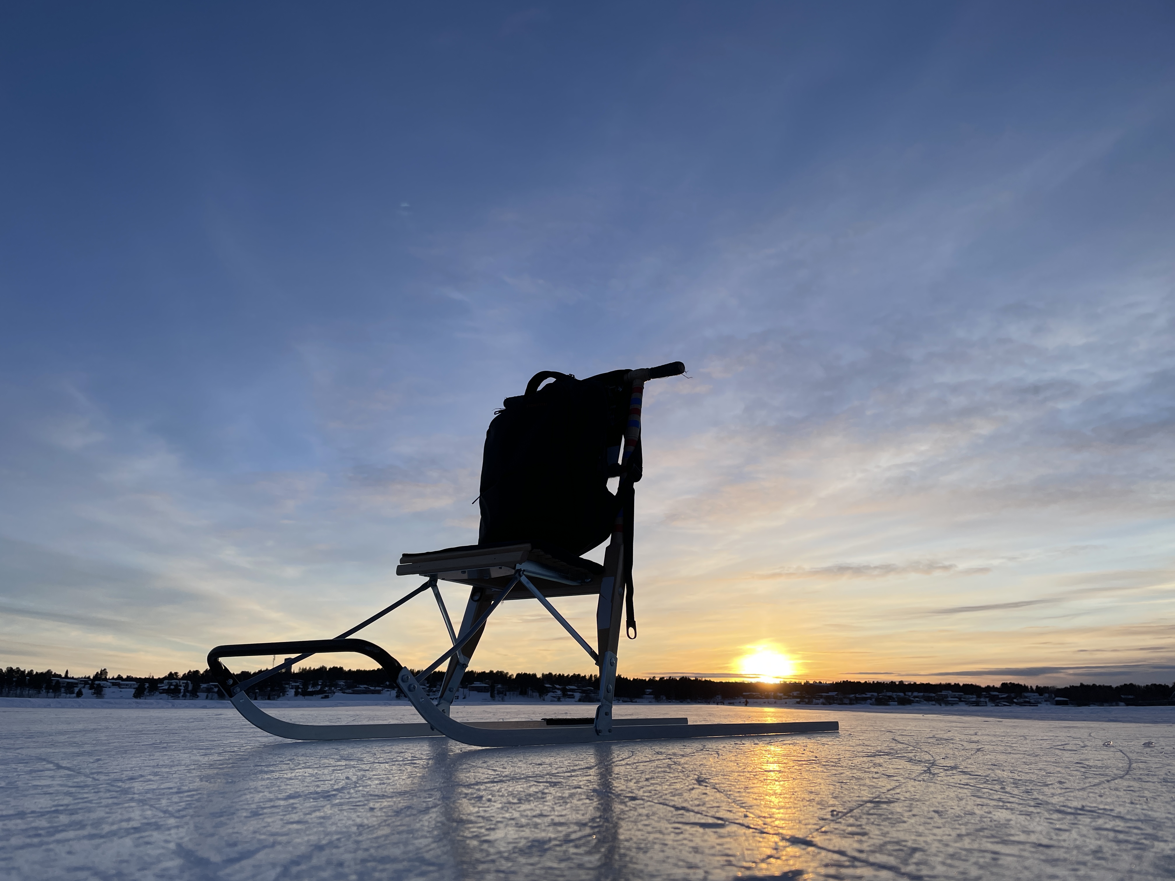 Sparksiluett och solnedgång.